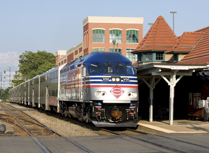 A photographic image of a passenger train leaving the station along the Southeast Corridor.
