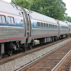 A photographic image of an Amtrak passenger train traveling.